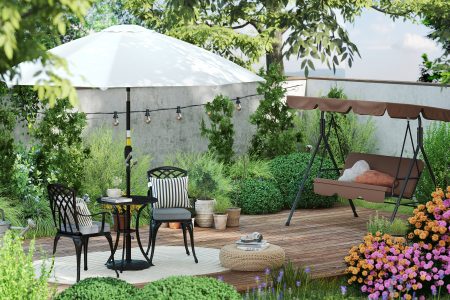 Leagănul, umbrela și mobilierul elegant formează un colț de relaxare idilic, înconjurat de vegetație luxuriantă pentru zile însorite în armonie cu natura.